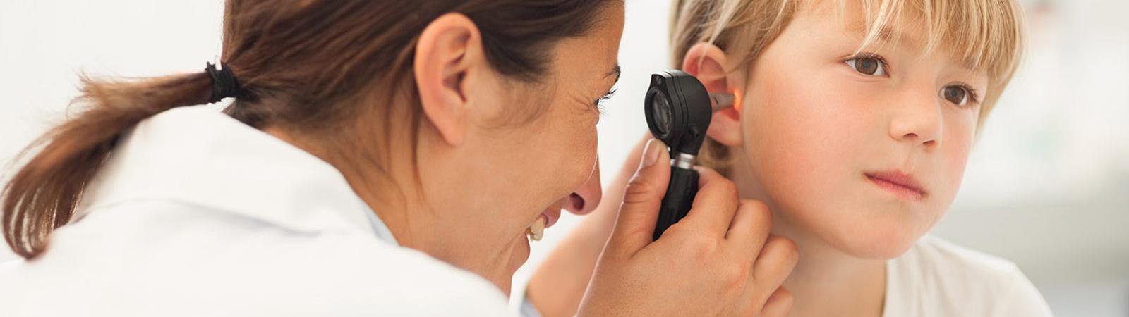 Doctor examining child